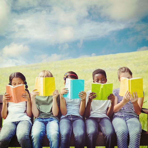 Photo composite image of children reading books at park