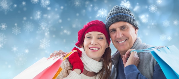 Composite image of couple with shopping bags