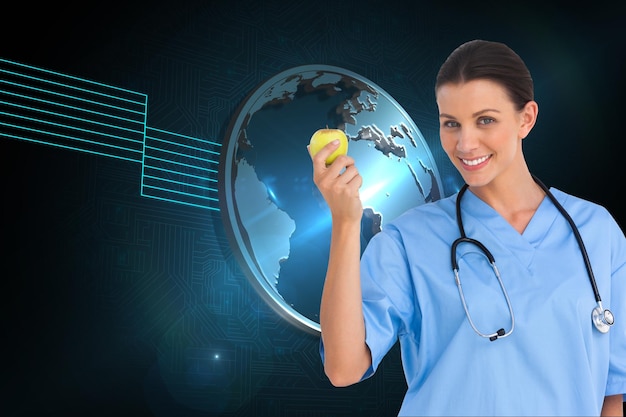 Composite image of happy surgeon holding an apple and smiling at camera