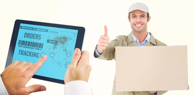 Composite image of man using tablet pc