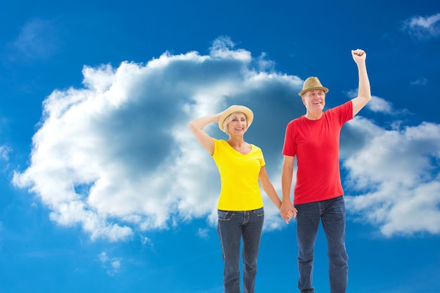 Composite image of mature couple walking and holding hands