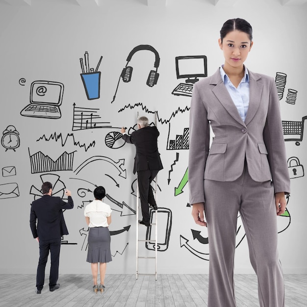 Composite image of portrait of a brunette businesswoman posing