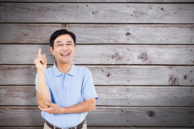 Composite image of portrait of happy man gesturing