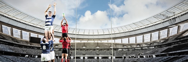 Composite image of rugby players playing match