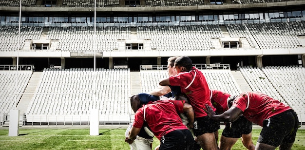 Composite image of rugby players playing match