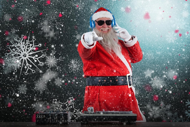 Composite image of santa claus mixing sound