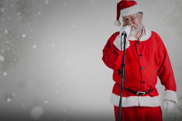 Composite image of santa claus singing songs against white background