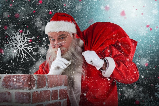 Composite image of santa claus with finger on lips standing beside chimney