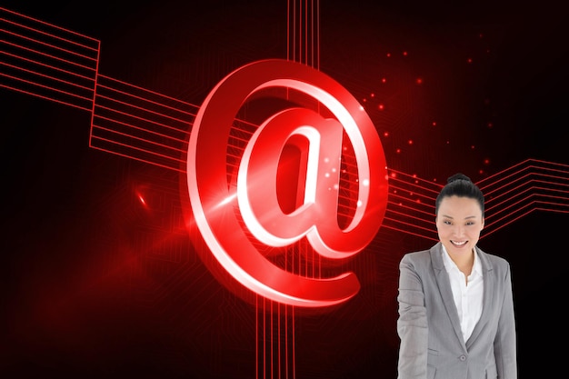 Composite image of smiling asian businesswoman pointing