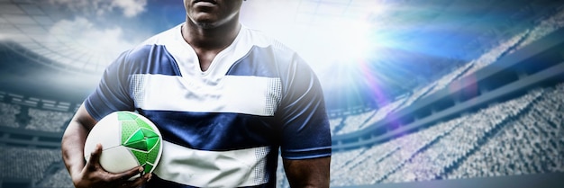 Composite image of strong rugby player