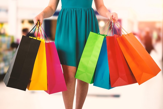 Composite image of women holding shopping bag