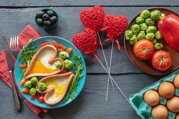 composition breakfast scrambled eggs with vegetables on a wooden background good morning holiday