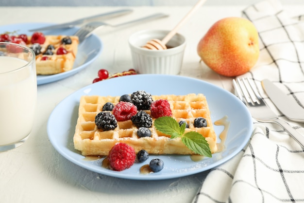 Composition of breakfast with belgian waffles