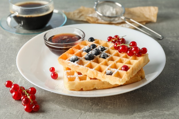 Composition of breakfast with belgian waffles