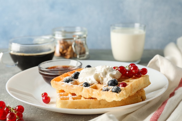 Composition of breakfast with belgian waffles