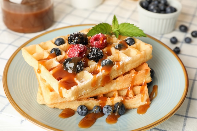 Composition of breakfast with belgian waffles