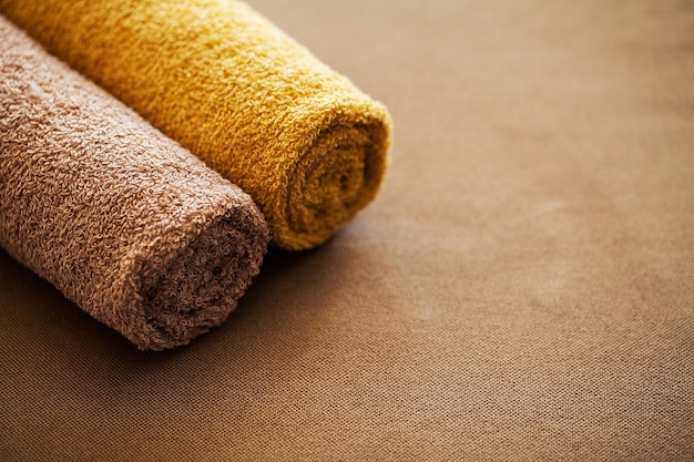 Composition brown towel in hotel room of spa treatment