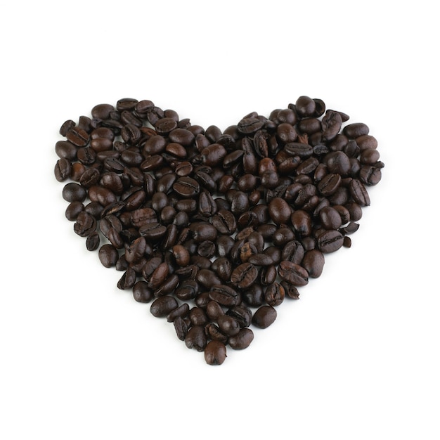 Composition of coffee beans in heart form isolated on white