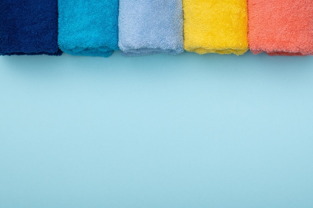 Composition of colored cotton towels the concept of softness and purity