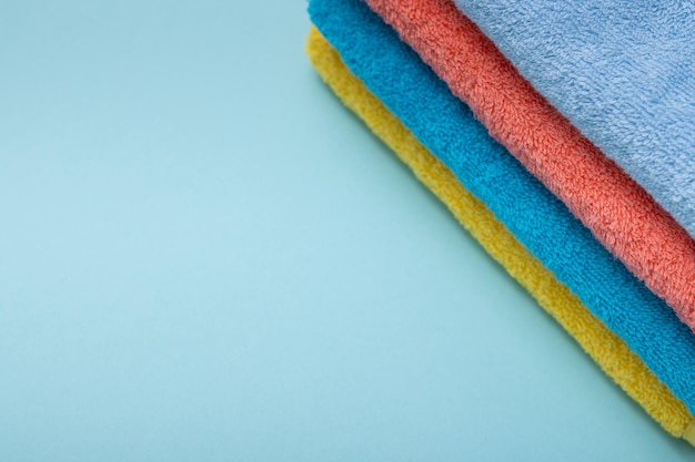 Composition of colored cotton towels the concept of softness and purity