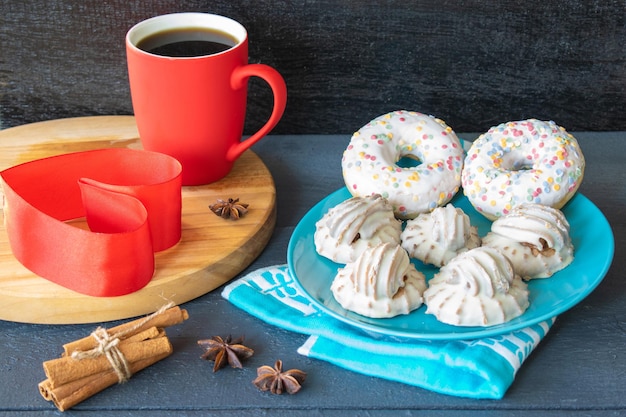 composition a cup of coffee and a cake breakfast on a wooden background sweets valentines day