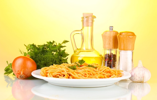 Composition of the delicious spaghetti with tomato sauce on bright background