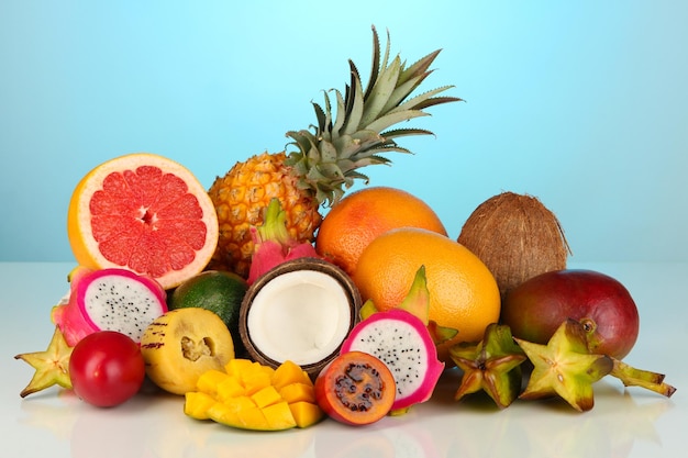 Composition of exotic fruits on blue background