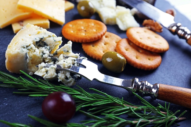 Composition of fresh cheese fruits and vegetables on the table close up