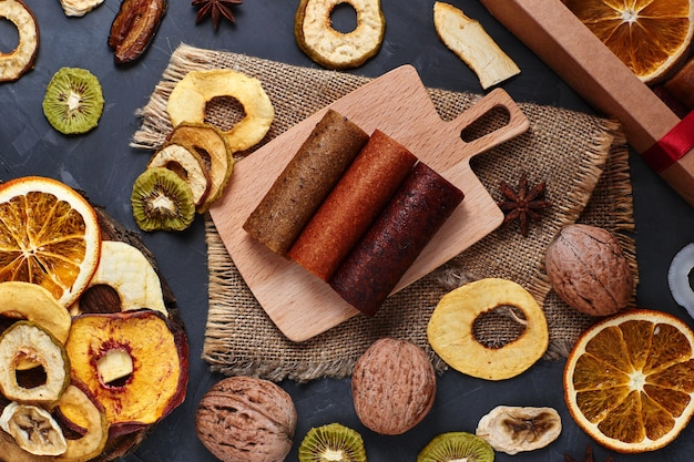 Composition of fruit pastille and dried fruits on the table