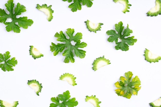 Composition of healthy fresh green bitter gourd with green leaves