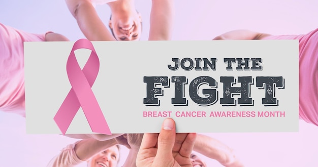 Composition of pink ribbon logo and breast cancer text, with diverse group of smiling women