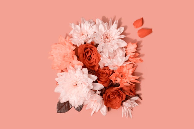 Composition of roses and chrysanthemums on pink background