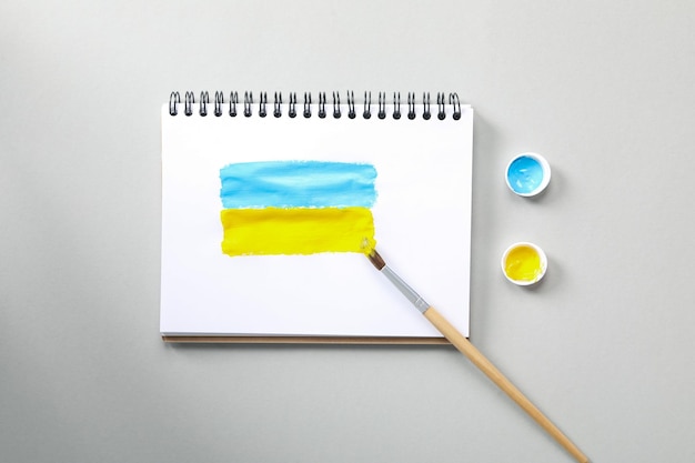 Composition for soncept Save Ukraine on light gray background top view