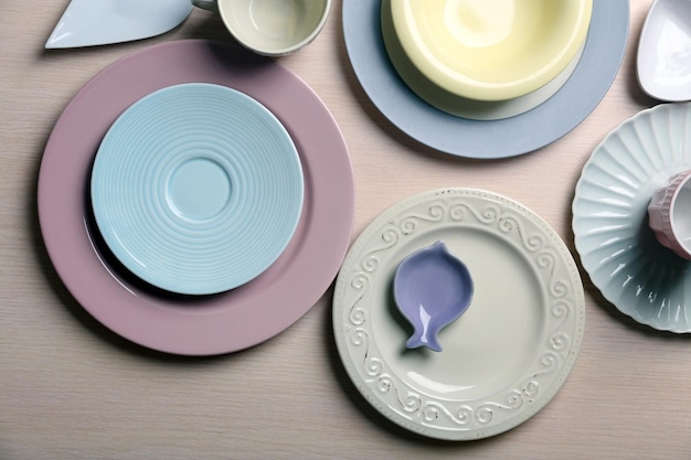 Composition of tableware on rosy background