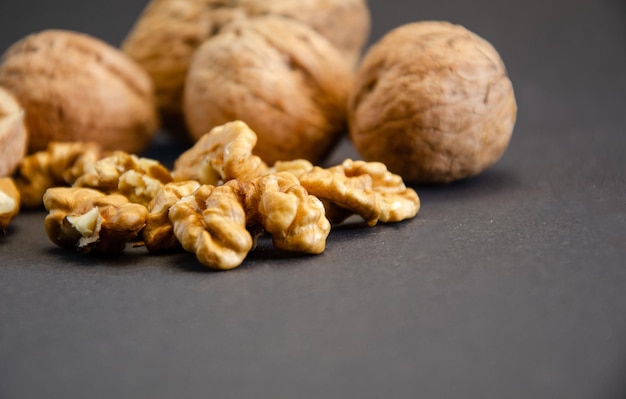 Photo composition of walnuts closeup on a black background