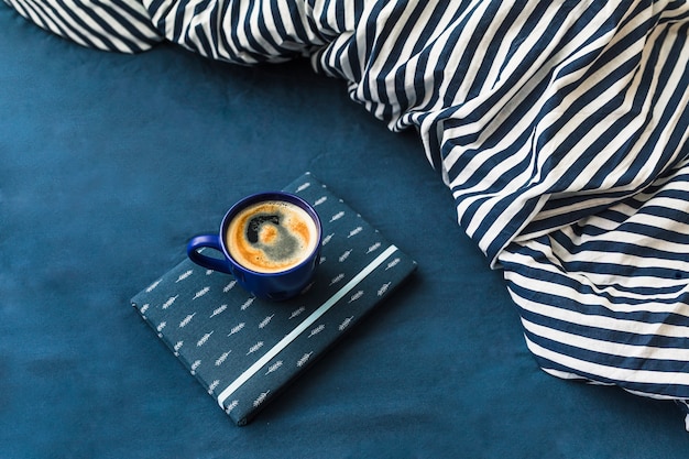 Composition with coffee cup in blue colours