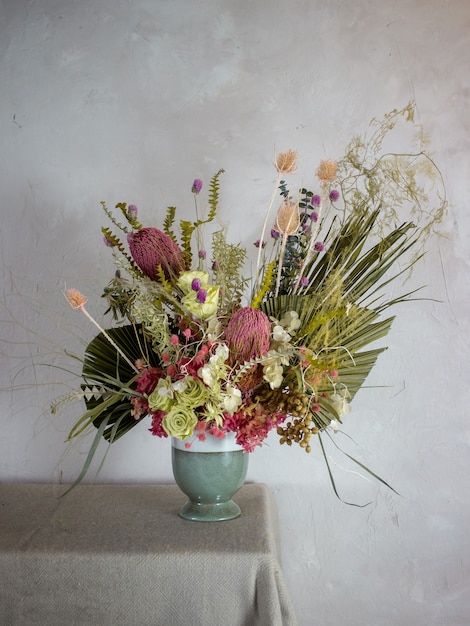 composition with dried flowers on a dark background