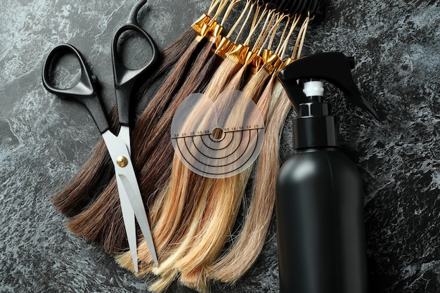 Composition with hair extension accessories on dark background