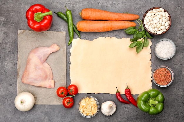 Composition with ingredients for delicious turkey chili on grey background