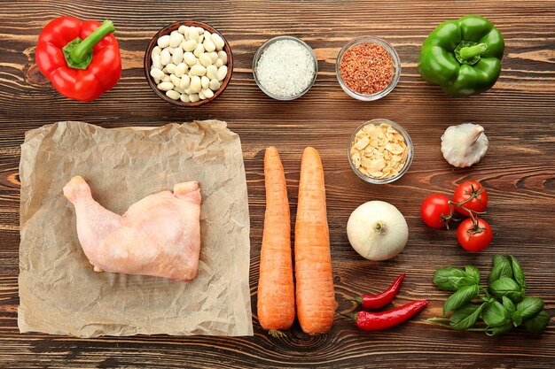 Composition with ingredients for delicious turkey chili on wooden background