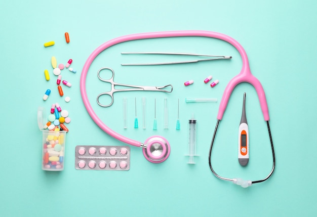 Composition with medical supplies on color background