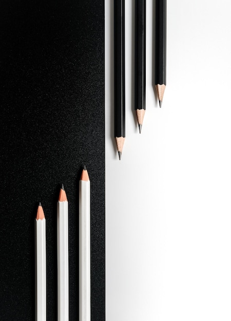 Composition with pencils on a black and white background