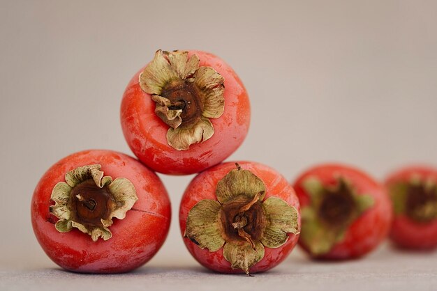 Composition with several ripe persimmons close up