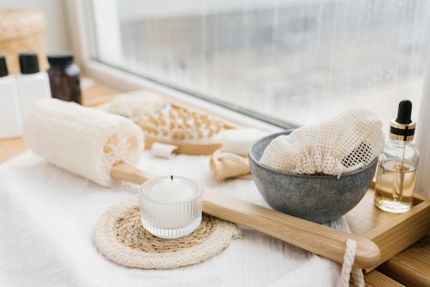 A composition with spa accessories on the white windowsill of a beauty salon Body care