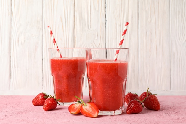 Composition with strawberry cocktails on pink table. Summer drink