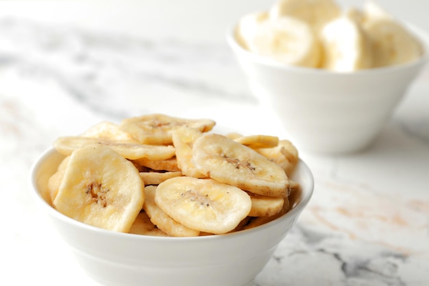 Composition with sweet banana slices   , top view with space for text. Dried fruit as healthy snack. Healthy breakfast