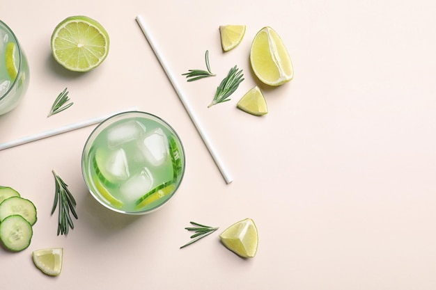 Photo composition with tasty lemonade on light background top view