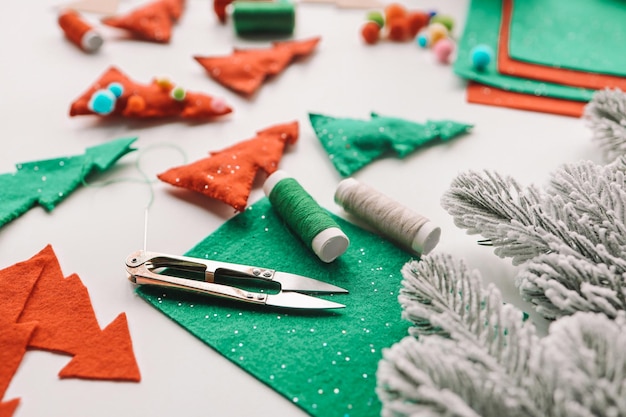 Photo composition with threads and sewing accessories on white background