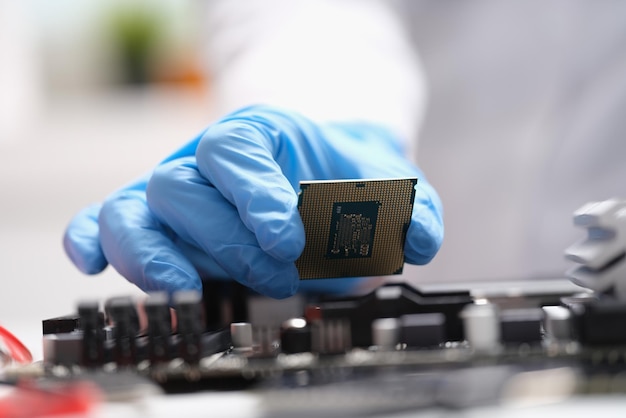 Computer engineers hand is holding cpu processor