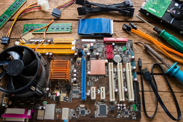 Computer hardware repair on a wooden background